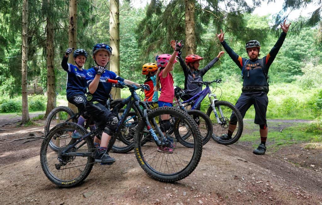 Kids having MTB coaching in the forest
