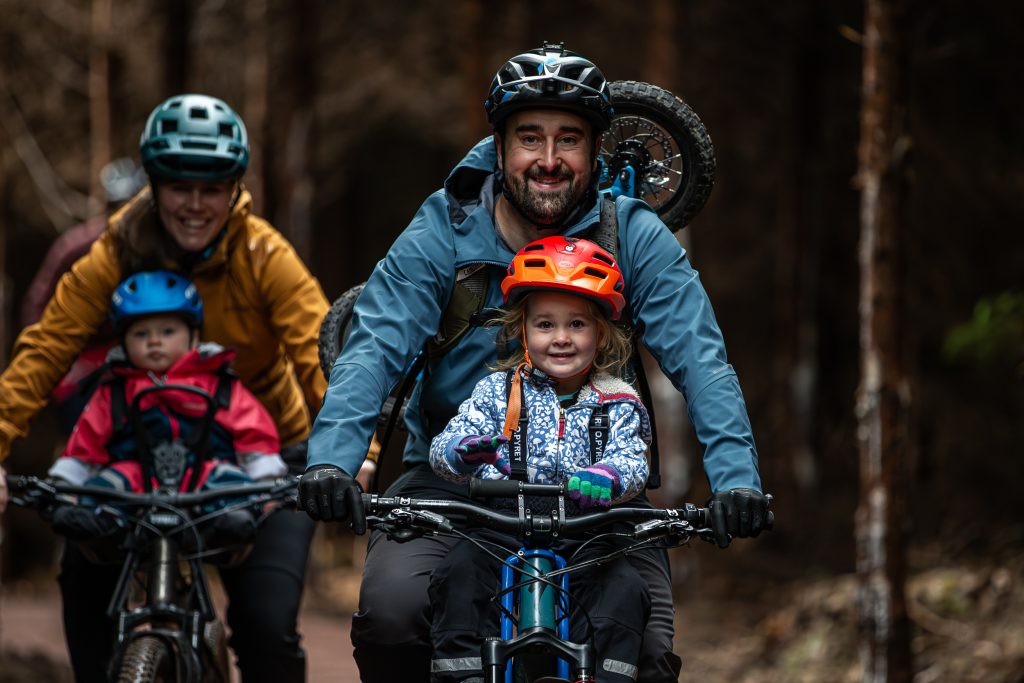 family riding with small children on new Old Bob trail in Forest of Dean